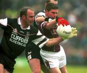30 June 2002; Paul Clancy of Galway holds off the challenge of Sligo's Paul Durkan and Patrick Naughton during the Bank of Ireland Connacht Senior Football Championship Final match between Galway and Sligo at MacHale Park in Castlebar, Mayo. Photo by David Maher/Sportsfile