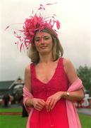 30 June 2002; Racegoers Michelle Clifford, from Cork, centre, Winner of The Best Dressed Lady competition, at The Curragh Racecourse in Kildare. Photo by Damien Eagers/Sportsfile