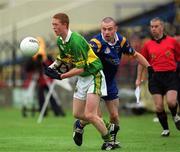 30 June 2002; Colm Cooper of Kerry is tackled by Wicklow's Brendan Daly during the Bank of Ireland All-Ireland Senior Football Championship Qualifying Round 2 match between Kerry and Wicklow at O'Moore Park in Portlaoise, Laois. Photo by Aoife Rice/Sportsfile