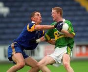 30 June 2002; Colm Cooper of Kerry is tackled by Wicklow's Garry Jameson during the Bank of Ireland All-Ireland Senior Football Championship Qualifying Round 2 match between Kerry and Wicklow at O'Moore Park in Portlaoise, Laois. Photo by Aoife Rice/Sportsfile