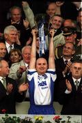 30 June 2002; Waterford captain Fergal Hartley lifts the trophy following his side's victory the Guinness Munster Senior Hurling Championship Final match between Waterford and Tipperary at Páirc Uí Chaoimh in Cork. Photo by Brendan Moran/Sportsfile