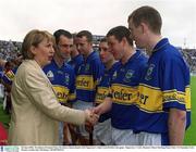 30 June 2002; President of Ireland Mary McAleese shakes hands with Tipperary's John Carroll before the game. Guinness Munster Hurling Final, Waterford v Tipperary, Pairc Ui Chaoimh, Cork. Picture credit; Ray McManus / SPORTSFILE