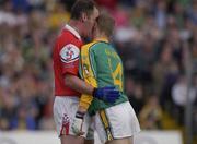 29 June 2002; Graham Geraghty, Meath, clashes with Seamus O'Hanlon, Louth off the ball. Meath v Louth, All Ireland Football Qualifier Round 2, Pairc Tailteann, Navan, Co, Meath. Picture credit; Damien Eagers / SPORTSFILE *EDI*