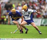 30 June 2002; Lar Corbett, Tipperary, in action against Waterford's Eoin Murphy. Waterford v Tipperary, Guinness Munster Hurling Final, Pairc Ui Chaoimh, Cork. Picture credit; Brendan Moran / SPORTSFILE