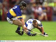 30 June 2002; Eoin McGrath, Waterford, in action against Thomas Costello, Tipperary. Waterford v Tipperary, Guinness Munster Hurling Final, Pairc Ui Chaoimh, Cork. Picture credit; Brendan Moran / SPORTSFILE