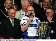 30 June 2002; Waterford captain Fergal Hartley makes his speech in the company of Christy Cooney, right, Chairman of the Munster Council, and Michael Whelan of Guinness. Waterford v Tipperary, Guinness Munster Hurling Final, Pairc Ui Chaoimh, Cork. Picture credit; Brendan Moran / SPORTSFILE