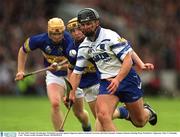 30 June 2002; Seamus Prendergast, Waterford, in action against Tipperary players Eamonn Corcoran and Paul Ormonde. Guinness Munster Hurling Final, Waterford v Tipperary, Pairc Ui Chaoimh, Cork.  Picture credit; Brendan Moran / SPORTSFILE