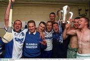 30 June 2002; Waterford players and officials celebrate in the dressing room. Guinness Munster Hurling Final, Waterford v Tipperary, Pairc Ui Chaoimh, Cork.  Picture credit; Ray McManus / SPORTSFILE