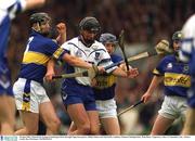 30 June 2002; Waterford's Seamus Prendergast burst through Tipperary players Philip Maher and Paul Kelly. Guinness Munster Hurling Final, Waterford v Tipperary, Pairc Ui Chaoimh, Cork.  Picture credit; Ray McManus / SPORTSFILE