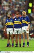 30 June 2002; Tipperary forward line of, from left, Eoin Kelly, John Carroll and Lar Corbett stand for the National Anthem before the game. Waterford v Tipperary, Guinness Munster Hurling Final, Pairc Ui Chaoimh, Cork. Picture credit; Brendan Moran / SPORTSFILE