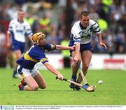 30 June 2002; Ken McGrath, Waterford, in action against Eamonn Corcoran, Tipperary. Waterford v Tipperary, Guinness Munster Hurling Final, Pairc Ui Chaoimh, Cork. Picture credit; Brendan Moran / SPORTSFILE