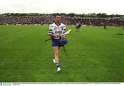 30 June 2002; Waterford's Brian Greene leaves the field after defeating Tipperary. Waterford v Tipperary, Guinness Munster Hurling Final, Pairc Ui Chaoimh, Cork. Picture credit; Brendan Moran / SPORTSFILE