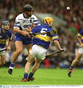 30 June 2002; Seamus Prendergast, Waterford, in action against Paul Kelly, Tipperary. Waterford v Tipperary, Guinness Munster Hurling Final, Pairc Ui Chaoimh, Cork. Picture credit; Brendan Moran / SPORTSFILE