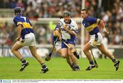 30 June 2002; Paul Flynn, Waterford, in action against Tipperary's Paul Kelly (7), Thomas Dunne and Brian O'Meara. Waterford v Tipperary, Guinness Munster Hurling Final, Pairc Ui Chaoimh, Cork. Picture credit; Brendan Moran / SPORTSFILE