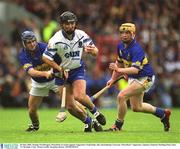 30 June 2002; Seamus Prendergast, Waterford, in action against Tipperary's Paul Kelly, left, and Eamonn Corcoran. Waterford v Tipperary, Guinness Munster Hurling Final, Pairc Ui Chaoimh, Cork. Picture credit; Brendan Moran / SPORTSFILE