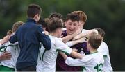 16 June 2017; Limerick Desmond goalkeeper Ethan Hurley is congratulated by his team-mates after he saved the winning penalty during the SFAI Umbro Kennedy Cup Plate Final match between Limerick Desmond and North Dublin Schoolboys League at the University of Limerick in Limerick. Photo by Matt Browne/Sportsfile