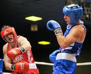 3 February 2012; Joe Ward, left, Moate Boxing Club, Co. Westmeath, exchanges punches with Kenneth Egan, Neilstown Boxing Club, Dublin, during their 81kg Bout. 2012 National Elite Boxing Championship Finals, National Stadium, Dublin. Picture credit: David Maher / SPORTSFILE