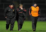 4 February 2012; Down manager James McCartan, centre, along with his assistant managers Jerome Johnston, left, and Aidan O'Rourke, right, leave the field at half time. Allianz Football League, Division 1, Round 1, Down v Donegal, Pairc Esler, Newry, Co. Down. Picture credit: Oliver McVeigh / SPORTSFILE