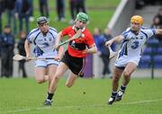 5 February 2012; Brian O'Sullivan, UCC, in action against Christopher Ryan,18, Kevin Moran, Waterford. Waterford Crystal Cup Hurling, Quarter-Final, Waterford v UCC, WIT Sportsgrounds, Waterford. Picture credit: Matt Browne / SPORTSFILE