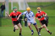 5 February 2012; Christopher Ryan, Waterford, in action against Brian O'Sullivan,13, and Paul Haughney, UCC. Waterford Crystal Cup Hurling, Quarter-Final, Waterford v UCC, WIT Sportsgrounds, Waterford. Picture credit: Matt Browne / SPORTSFILE