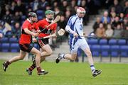 5 February 2012; Dean Twomey, Waterford, in action against Dara Fives and William Egan,23, UCC. Waterford Crystal Cup Hurling, Quarter-Final, Waterford v UCC, WIT Sportsgrounds, Waterford. Picture credit: Matt Browne / SPORTSFILE