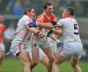 5 February 2012; Andy Mallon, Armagh, in action against Graham Canty, left and Noel O'Leary, Cork. Allianz Football League, Division 1, Round 1, Armagh v Cork, Morgan Athletic Grounds, Armagh. Picture credit: David Maher / SPORTSFILE