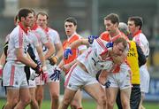 5 February 2012; Michael Shields, Cork, clashes with Finnian Moriarty, Armagh. Allianz Football League, Division 1, Round 1, Armagh v Cork, Morgan Athletic Grounds, Armagh. Picture credit: David Maher / SPORTSFILE