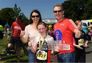17 June 2017; Edel Murphy, 11, of Shercock AC, Co Cavan, with her parents Diane and Brendan Murphy after winning the girls fun run during the Irish Runner 5 Mile at the Phoenix Park in Dublin. Photo by Sam Barnes/Sportsfile