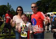 17 June 2017; Edel Murphy, 11, of Shercock AC, Co Cavan, with her parents Diane and Brendan Murphy after winning the girls fun run during the Irish Runner 5 Mile at the Phoenix Park in Dublin. Photo by Sam Barnes/Sportsfile