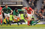 5 February 2012; Rhys Priestland, Wales, escapes the tackle of Mike Ross and Stephen Ferris, Ireland. RBS Six Nations Rugby Championship, Ireland v Wales, Aviva Stadium, Lansdowne Road, Dublin. Picture credit: Brendan Moran / SPORTSFILE