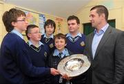 7 February 2012; Alan Quinlan in conversation with pupils, from Coláiste an Chraoibhín, from left, Taigh O'Mahony, Nathan Roche, Shane Lillis, Kieran O'Donovan, and Kyran Lyons. Ulster Bank, part of the Royal Bank of Scotland Group, brought the prestigious RBS 6 Nations Trophy and Triple Crown to Cork today, Tuesday 7th February. Munster and Irish rugby stalwarts, David Wallace, Frankie Sheahan and Alan Quinlan took part in a number of events to showcase the famous trophies and discuss all things rugby to coincide with the RBS 6 Nations Championship. The trio started their day at a business breakfast hosted by Ulster Bank at the Maryborough Hotel, Cork before Sheahan, Quinlan and Wallace brought the trophies on to the Ulster Bank Patrick Street branch for staff and customers. The final stop on the tour was Colaiste Craoibhinn in Fermoy, where the players met hundreds of pupils  and took part in a questions and answers session. Ulster Bank is the Official Community Partner to the IRFU and the tour is part of their grass roots programme which also aims to highlight their Ulster Bank RugbyForce club initiative. Ulster Bank RugbyForce encourages rugby supporters, their friends and families to give something back to their local community rugby club by volunteering to undertake renovations to clubhouses and grounds.  Four lucky clubs (one from each province) will be selected for a very special makeover winning €5,000 of goods and resources to use toward their planned club development during the Ulster Bank RugbyForce weekend in June. 50 other clubs will receive a smaller support of €250 through the programme. Clubs must register for Ulster Bank RugbyForce online at www.ulsterbank.com/rugby by April 13th 2012. Coláiste an Chraoibhín, Fermoy, Co. Cork. Picture credit: Pat Murphy / SPORTSFILE