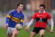 22 January 2012; Paddy Codd, Tipperary, in action against Gavin Ryan, UCC. McGrath Cup Football Semi-Final, Tipperary v University College Cork, Clonmel Sportsfield, Clonmel, Co. Tipperary. Picture credit: Stephen McCarthy / SPORTSFILE