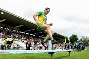 18 June 2017; Michael Murphy of Donegal jumps the bench before the team picture before the Ulster GAA Football Senior Championship Semi-Final match between Tyrone and Donegal at St Tiernach's Park in Clones, Co. Monaghan. Photo by Oliver McVeigh/Sportsfile