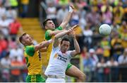 18 June 2017; Colm Cavanagh of Tyrone in action against Jamie Brennan, left, and Mícheál Carroll of Donegal during the Ulster GAA Football Senior Championship Semi-Final match between Tyrone and Donegal at St Tiernach's Park in Clones, Co. Monaghan. Photo by Ramsey Cardy/Sportsfile
