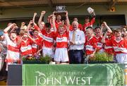 18 June 2017; Cian Byrne captain of Feathar-St Mogues, Co Wexford lifts the trophy after the Division 5 Final between Feathar-St Mogues, Co Wexford and Horsewood, Co. Wexford at the John West Féile na nGael national competition which took place this weekend across Carlow, Kilkenny and Waterford. This is the second year that the Féile na nGael and Féile Peile na nÓg have been sponsored by John West, one of the world’s leading suppliers of fish. The competition gives up-and-coming GAA superstars the chance to participate and play in their respective Féile tournament, at a level which suits their age, skills and strengths. Photo by Matt Browne/Sportsfile