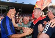18 June 2017; Waterford selector Dan Shanahan and a Cork supporter congratulate Cork selector Diarmuid O'Sullivan after the Munster GAA Hurling Senior Championship Semi-Final match between Waterford and Cork at Semple Stadium in Thurles, Co Tipperary.  Photo by Ray McManus/Sportsfile