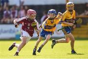 18 June 2017; Cillian Hackett of Dicksboro, Co. Kilkenny in action against Luke O'Halloran of Sixmilebridge, Co. Clare, during the John West Féile na nGael national competition which took place this weekend across Carlow, Kilkenny and Waterford. This is the second year that the Féile na nGael and Féile Peile na nÓg have been sponsored by John West, one of the world’s leading suppliers of fish. The competition gives up-and-coming GAA superstars the chance to participate and play in their respective Féile tournament, at a level which suits their age, skills and strengths. Photo by Matt Browne/Sportsfile