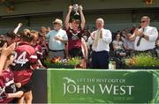 18 June 2017; Ethan Dorney captain of The Hospital, Herbertstown, Co. Limerick team lifts the cup after it was presented by Uachtarán Chumann Lúthchleas Aogán Ó Fearghail After the Division 8 Final during the John West Féile na nGael national competition which took place this weekend across Carlow, Kilkenny and Waterford. This is the second year that the Féile na nGael and Féile Peile na nÓg have been sponsored by John West, one of the world’s leading suppliers of fish. The competition gives up-and-coming GAA superstars the chance to participate and play in their respective Féile tournament, at a level which suits their age, skills and strengths. Photo by Matt Browne/Sportsfile