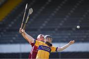 18 June 2017; Luke O'Halloran of Sixmilebridge, Co. Clare in action against Niall Rowe of Dicksboro, Co. Kilkenny, during the John West Féile na nGael national competition which took place this weekend across Carlow, Kilkenny and Waterford. This is the second year that the Féile na nGael and Féile Peile na nÓg have been sponsored by John West, one of the world’s leading suppliers of fish. The competition gives up-and-coming GAA superstars the chance to participate and play in their respective Féile tournament, at a level which suits their age, skills and strengths. Photo by Matt Browne/Sportsfile