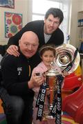 8 February 2012; RBS 6 Nations and Triple Crown Trophies arrive in Dublin: Leinster rugby stalwarts, Bernard Jackman and Shane Horgan are pictured with Mary McCarthy, aged 7, from Kilkenny, and the RBS 6 Nations Trophy and Triple Crown. The pair brought the prestigious trophies to the Ulster Bank Donnybrook branch to share with staff and customers as part of the bank’s RBS 6 Nations Trophy Tour which aims to highlight the Ulster Bank RugbyForce club initiative, where clubs can register by April 13th on www.ulsterbank.com/rugby for the chance to win a club makeover worth €5,000. The pair then travelled to Temple Street Children’s Hospital to share the trophies with the children. Temple Street Children's University Hospital, Dublin. Picture credit: Pat Murphy / SPORTSFILE