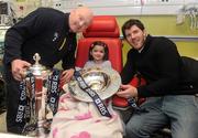 8 February 2012; RBS 6 Nations and Triple Crown Trophies arrive in Dublin: Leinster rugby stalwarts, Bernard Jackman and Shane Horgan are pictured with Sophie Phillips, aged 4, from Sligo, and the RBS 6 Nations Trophy and Triple Crown. The pair brought the prestigious trophies to the Ulster Bank Donnybrook branch to share with staff and customers as part of the bank’s RBS 6 Nations Trophy Tour which aims to highlight the Ulster Bank RugbyForce club initiative, where clubs can register by April 13th on www.ulsterbank.com/rugby for the chance to win a club makeover worth €5,000. The pair then travelled to Temple Street Children’s Hospital to share the trophies with the children. Temple Street Children's University Hospital, Dublin. Picture credit: Pat Murphy / SPORTSFILE