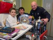 8 February 2012; RBS 6 Nations and Triple Crown Trophies arrive in Dublin: Leinster rugby stalwarts, Bernard Jackman and Shane Horgan are pictured with 11 year old Sean Long, from Cork, who took a break from his school work, and the RBS 6 Nations Trophy and Triple Crown. The pair brought the prestigious trophies to the Ulster Bank Donnybrook branch to share with staff and customers as part of the bank’s RBS 6 Nations Trophy Tour which aims to highlight the Ulster Bank RugbyForce club initiative, where clubs can register by April 13th on www.ulsterbank.com/rugby for the chance to win a club makeover worth €5,000. The pair then travelled to Temple Street Children’s Hospital to share the trophies with the children. Temple Street Children's University Hospital, Dublin. Picture credit: Pat Murphy / SPORTSFILE