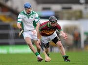 11 February 2012; Sylvie Óg Linnane, Gort, in action against Cathal Parlon, Coolderry. AIB GAA Hurling All-Ireland Senior Club Championship Semi-Final, Coolderry, Offaly, v Gort, Galway, Gaelic Grounds, Limerick. Picture credit: Stephen McCarthy / SPORTSFILE
