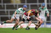 11 February 2012; Sylvie Óg Linnane, Gort, in action against Brian Carroll, left, and Barry Teehan, Coolderry. AIB GAA Hurling All-Ireland Senior Club Championship Semi-Final, Coolderry, Offaly, v Gort, Galway, Gaelic Grounds, Limerick. Picture credit: Stephen McCarthy / SPORTSFILE