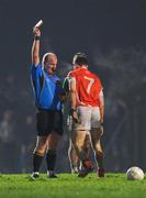 11 February 2012; Referee Maurice Condon issues Finnian Moriarty, Armagh, with a second yellow card before issuing a red. Allianz Football League, Division 1, Round 2, Kerry v Armagh, Austin Stack Park, Tralee, Co. Kerry. Picture credit: Stephen McCarthy / SPORTSFILE