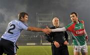 11 February 2012; Dublin captain Bryan Cullen, left, and Mayo captain Keith Higgins shake hands in front of referee Marty Duffy. Allianz Football League, Division 1, Round 2, Mayo v Dublin, McHale Park, Castlebar, Co. Mayo. Picture credit: David Maher / SPORTSFILE