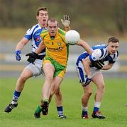 12 February 2012; Neil Gallagher, Donegal, in action against John Loughlin, left, and Paul Cahillane, Laois. Allianz Football League, Division 1, Round 2, Donegal v Laois, O'Donnell Park, Letterkenny, Co. Donegal. Picture credit: Oliver McVeigh / SPORTSFILE
