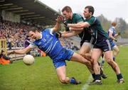 12 February 2012; Paul Finlay, Monaghan, is fouled by Daryl Flynn, centre, and Tommy O'Neill, right, Kildare. Allianz Football League, Division 2, Round 2, Monaghan v Kildare, St Tiernach's Park, Clones, Co Monaghan. Picture credit: Barry Cregg / SPORTSFILE