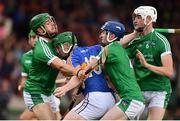 22 June 2017; Andrew Coffey of Tipperary is tackled by Limerick players, from left, Darragh Fanning, Dan Joy and Kyle Hayes during the Bord Gais Energy Munster GAA Under 21 Hurling Quarter-Final match between Limerick and Tipperary at the Gaelic Grounds in Limerick. Photo by Ramsey Cardy/Sportsfile