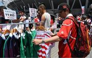 24 June 2017; A supporter checks out merchandise at the stadium before the international rugby match between Japan and Ireland in the Ajinomoto Stadium in Tokyo, Japan. Photo by Brendan Moran/Sportsfile
